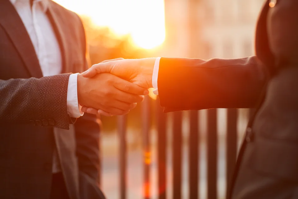 Business agreement handshake